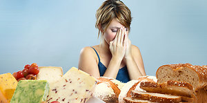 Testing. Woman at table of food